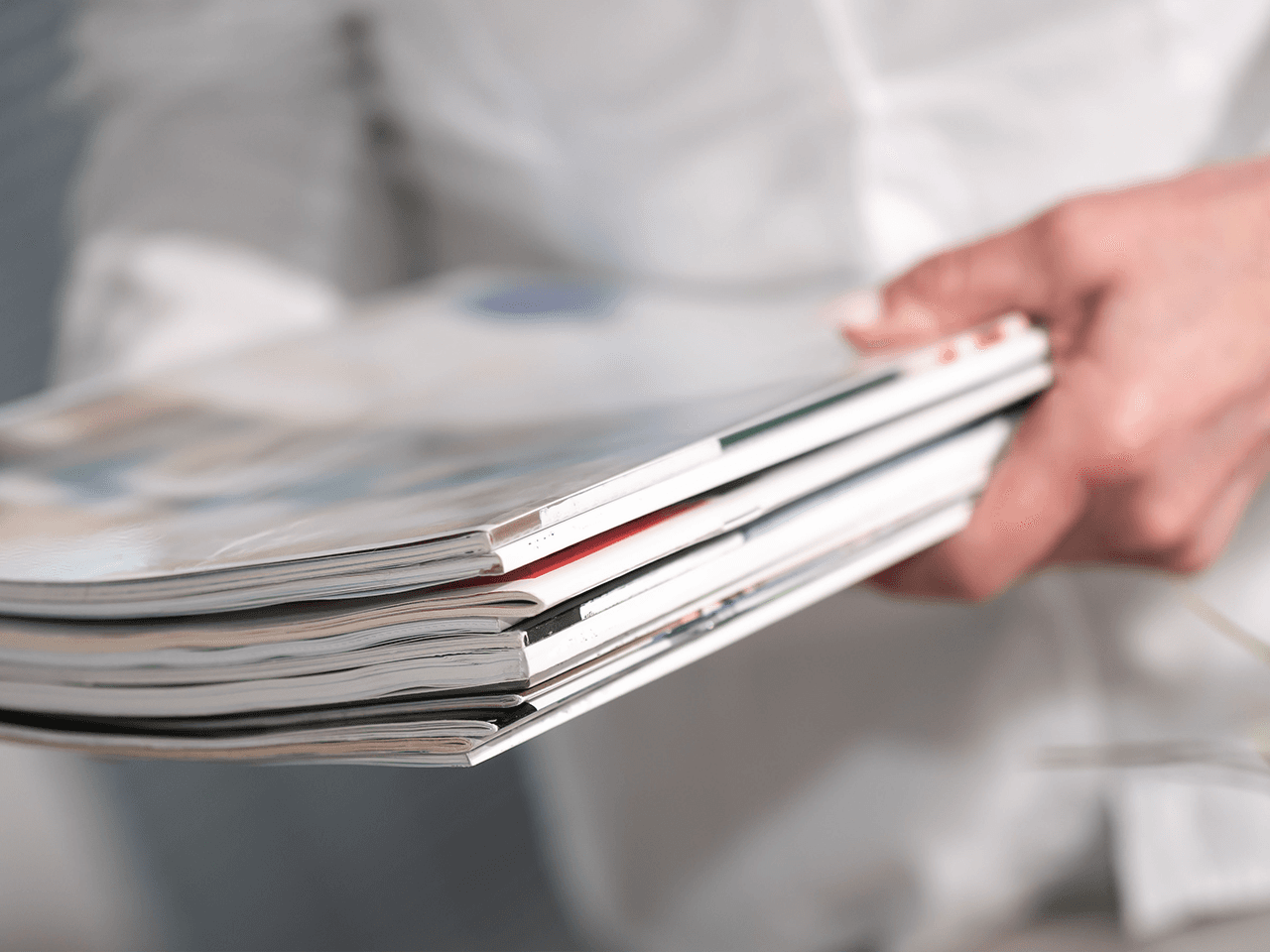 Photo: Stack of medical publications in the hands of one person